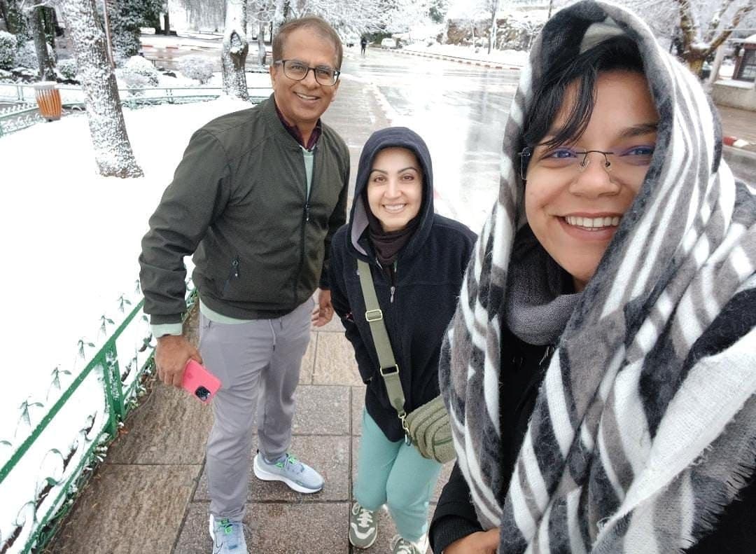 Selfie of three travelers in a snowy street